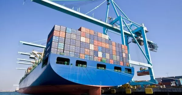 A container ship is loading and unloading at the port